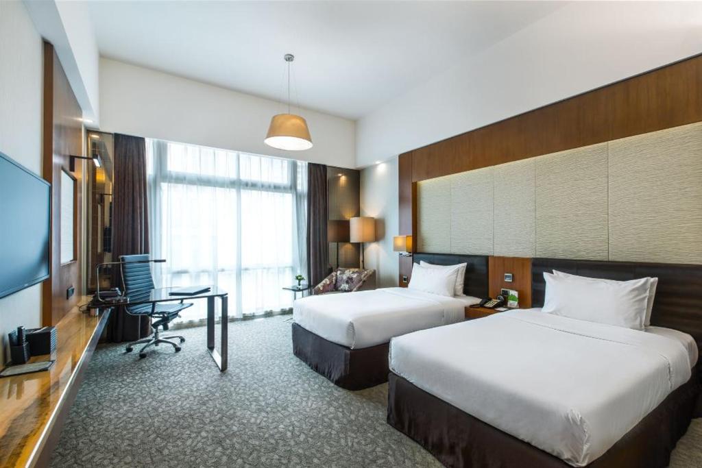 Postel nebo postele na pokoji v ubytování Vanburgh Hotel - Free shuttle bus transfer during Canton Fair