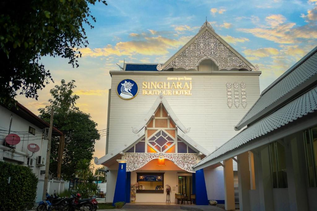 a church with a clock on the side of it at Singharaj Boutique Hotel in Chiang Mai