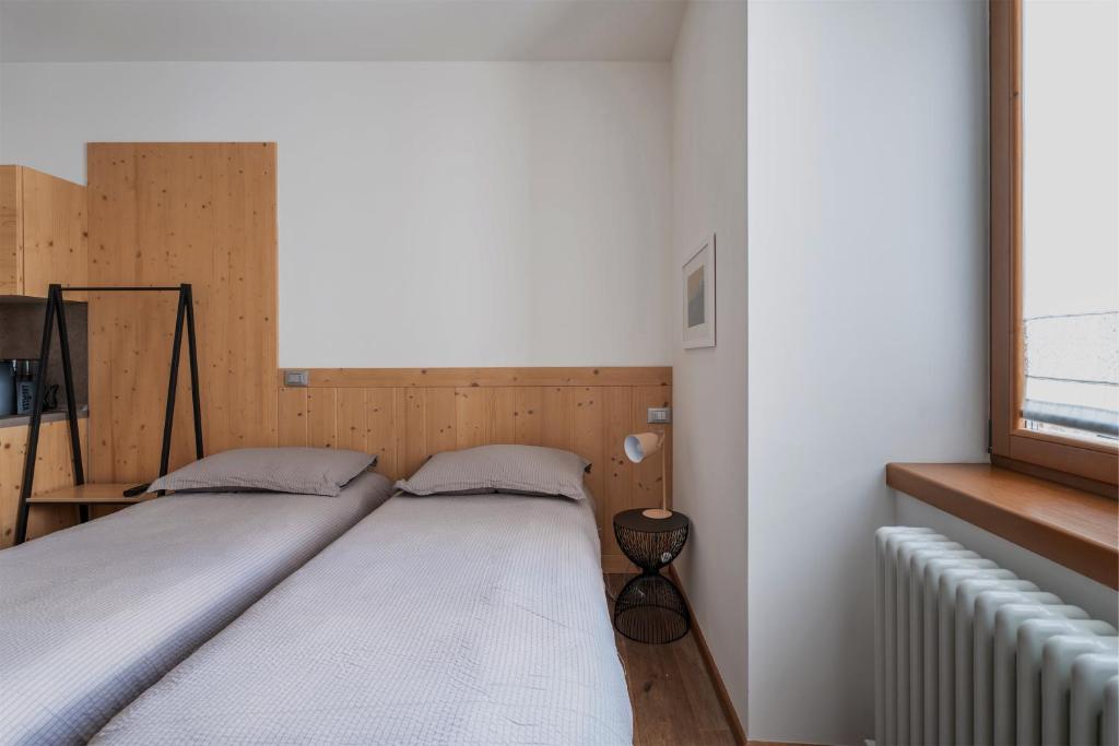 Postel nebo postele na pokoji v ubytování Pietra Rara Apartments