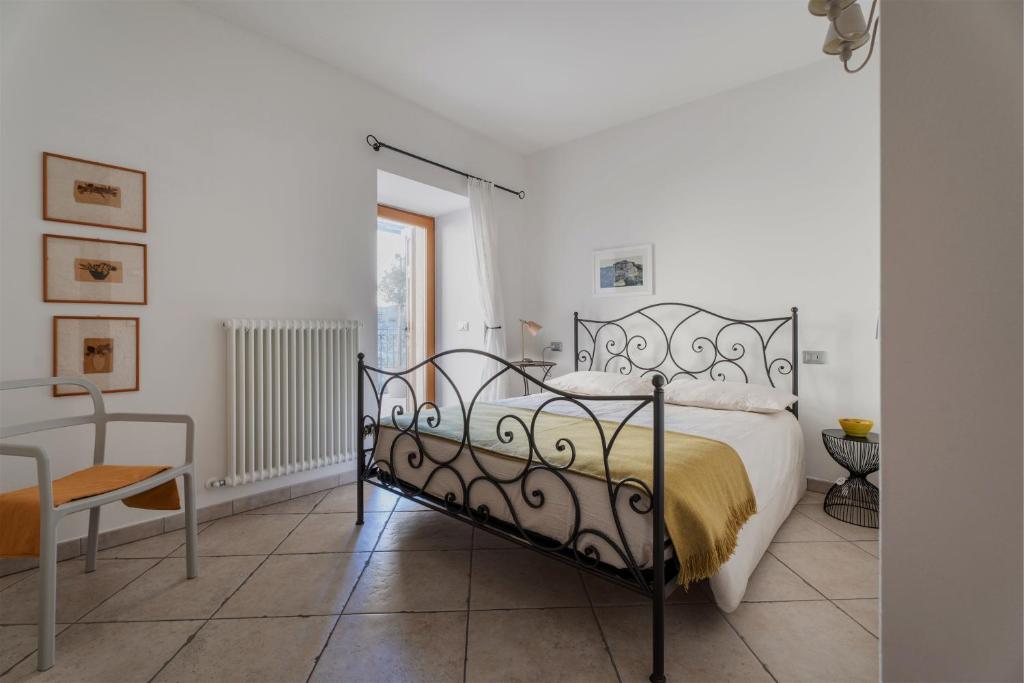 Postel nebo postele na pokoji v ubytování Pietra Rara Apartments
