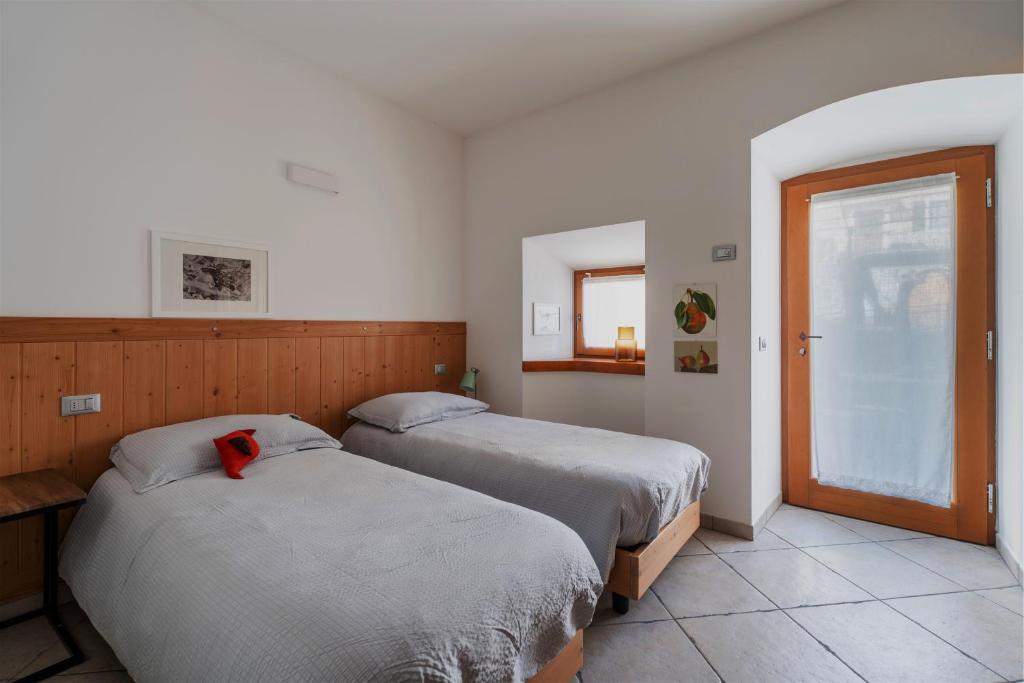 Postel nebo postele na pokoji v ubytování Pietra Rara Apartments