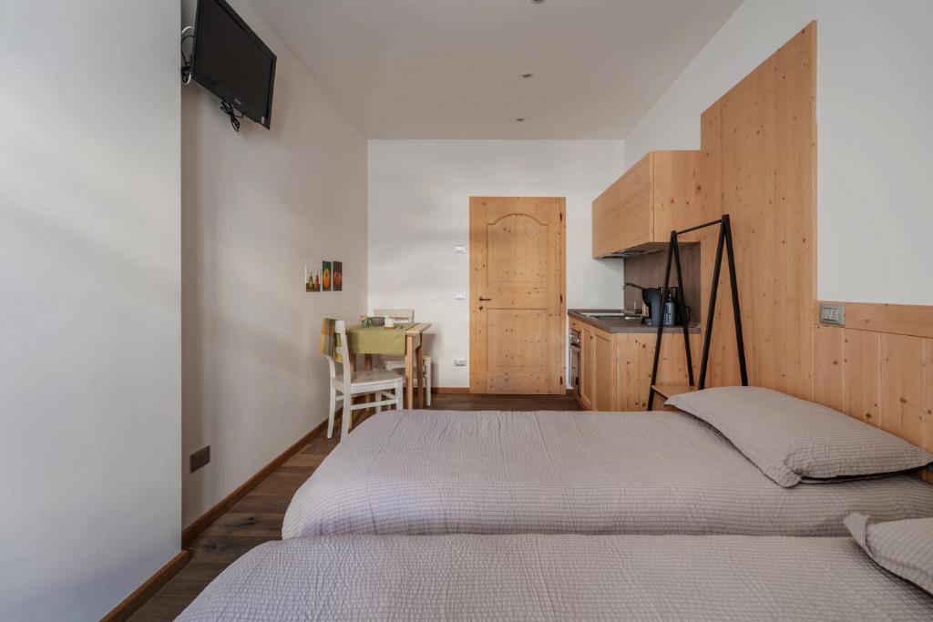 Postel nebo postele na pokoji v ubytování Pietra Rara Apartments