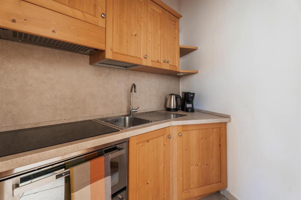 Kuchyň nebo kuchyňský kout v ubytování Pietra Rara Apartments