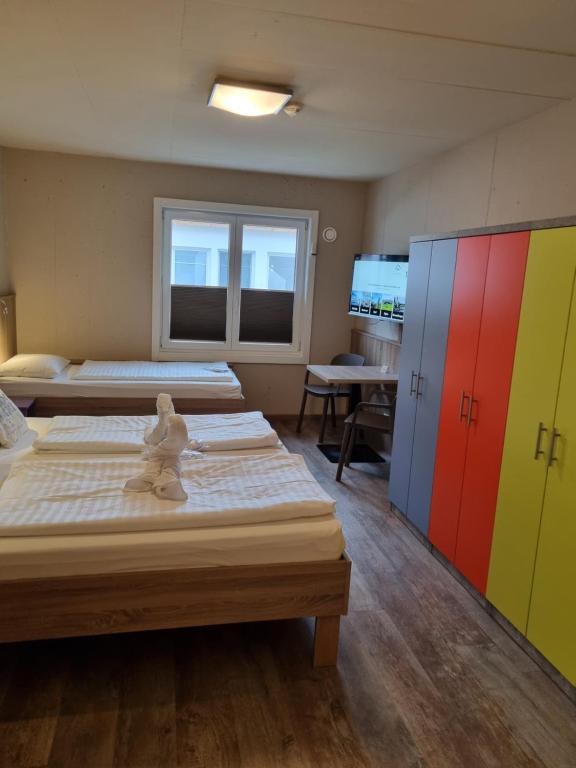 Posteľ alebo postele v izbe v ubytovaní Cubo Sport & Art Hotel