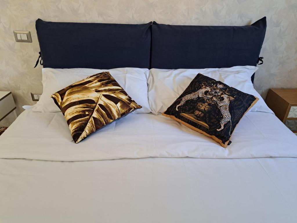 Łóżko lub łóżka w pokoju w obiekcie Amendola Rooms