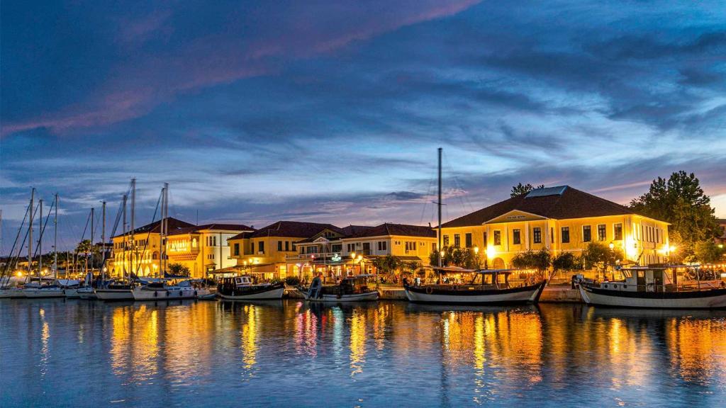 a group of boats docked in a marina at night at Crystal Cherry Apartment in Preveza