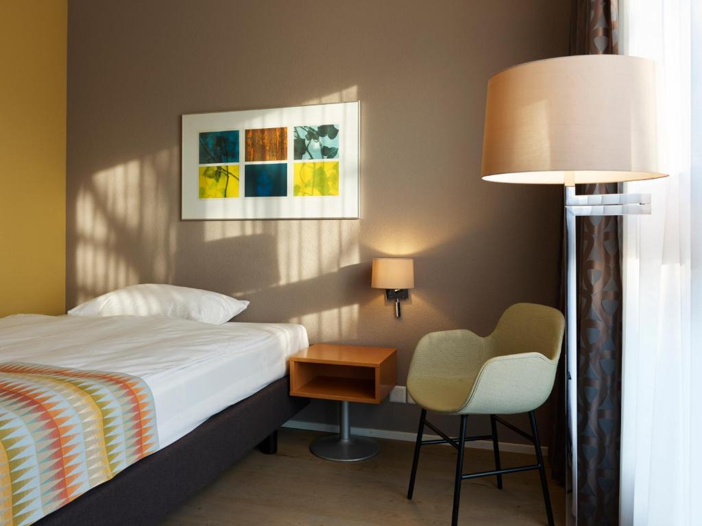 Postel nebo postele na pokoji v ubytování Hotel Berchtold