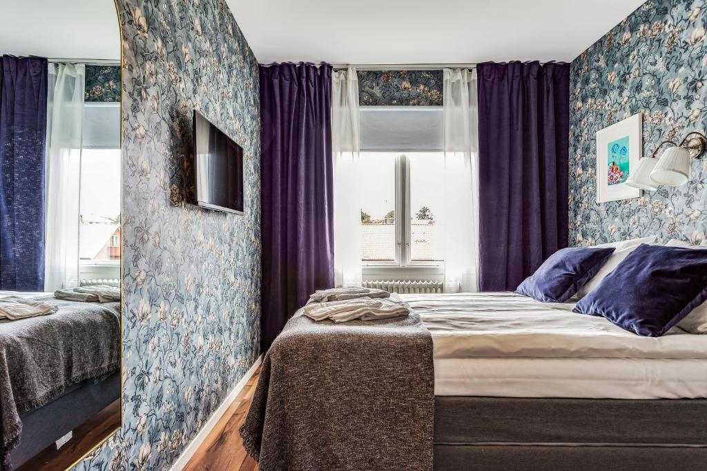 Postel nebo postele na pokoji v ubytování Hotell Nordevik