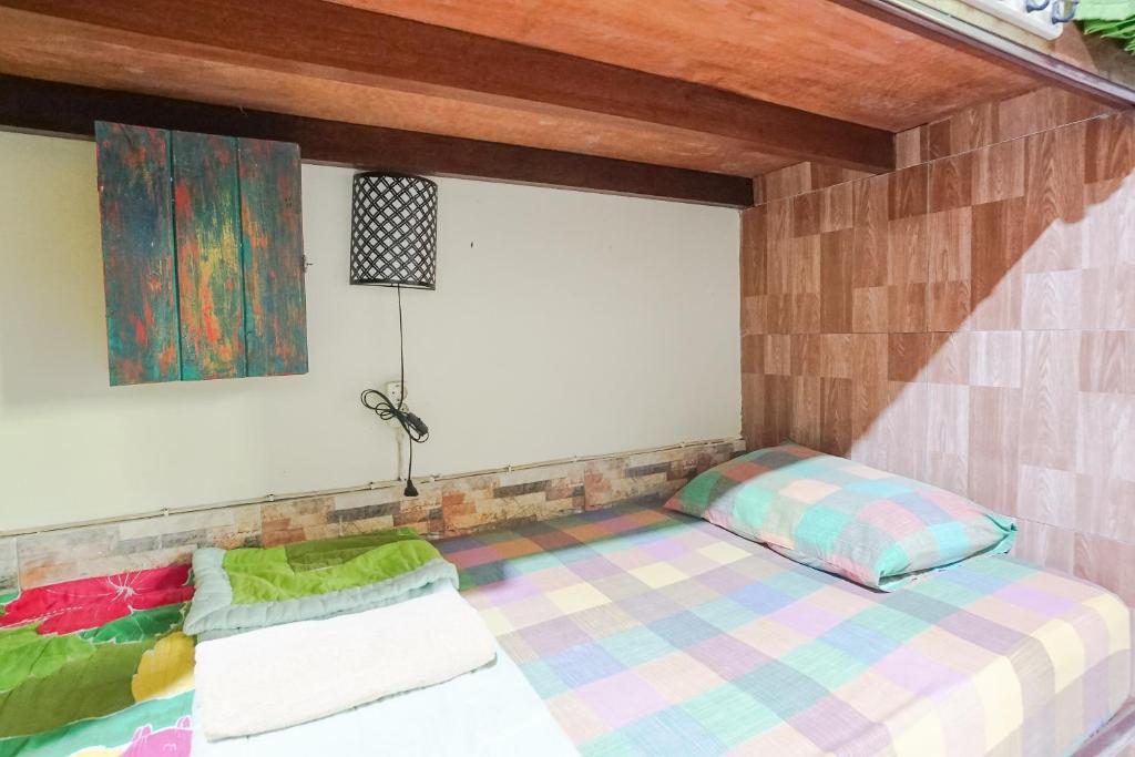 Postel nebo postele na pokoji v ubytování Green View Ubud Hostel Bali