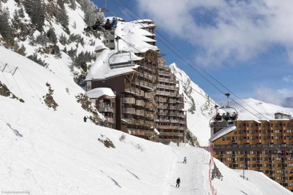 a ski slope in front of a building with a ski lift at Résidence Antarès - Avoriaz in Avoriaz