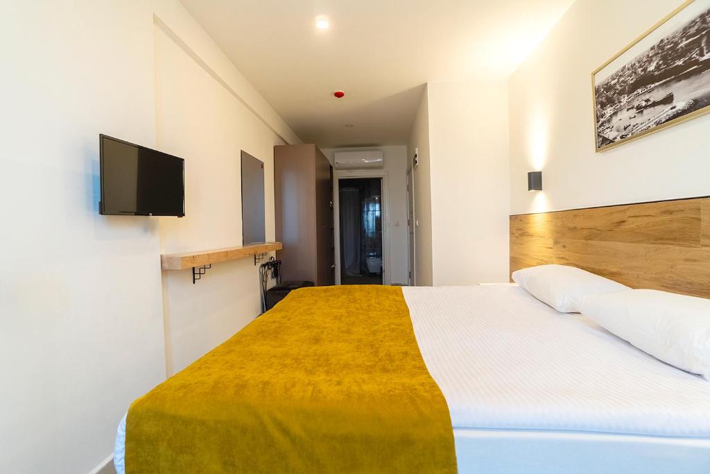 Postel nebo postele na pokoji v ubytování Tut Hotel