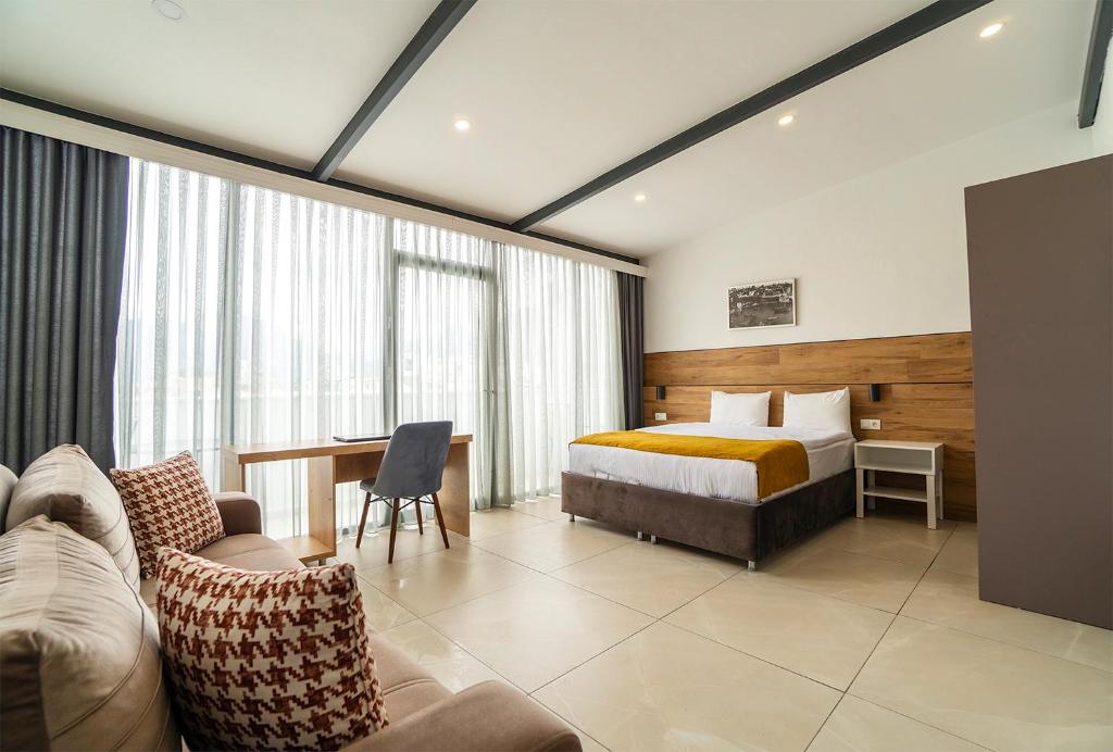Postel nebo postele na pokoji v ubytování Tut Hotel