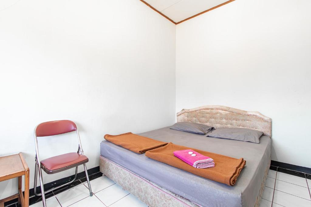 Postel nebo postele na pokoji v ubytování Abang Hotel Ciwidey