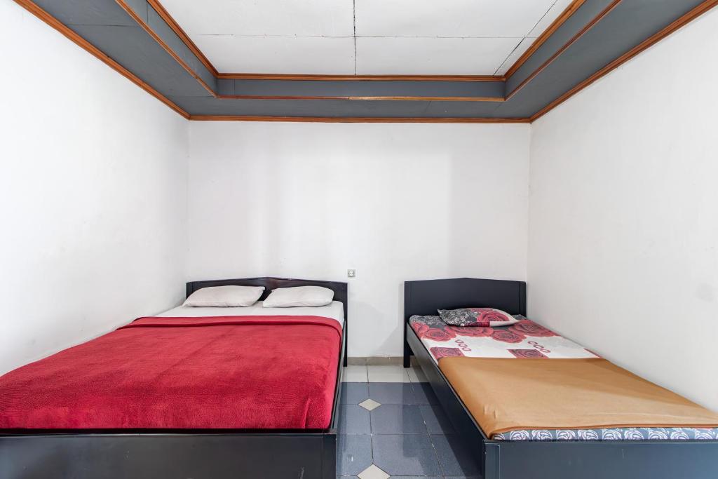 Postel nebo postele na pokoji v ubytování Abang Hotel Ciwidey