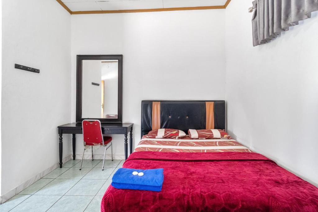 Postel nebo postele na pokoji v ubytování Abang Hotel Ciwidey