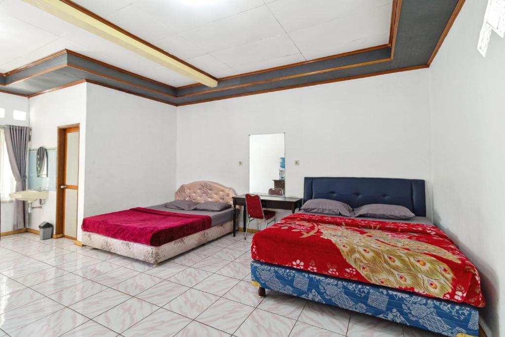 Postel nebo postele na pokoji v ubytování Abang Hotel Ciwidey