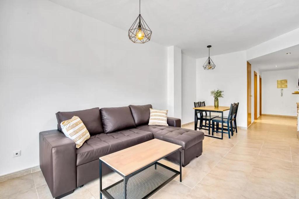 a living room with a couch and a table at Libélula in Guadalest