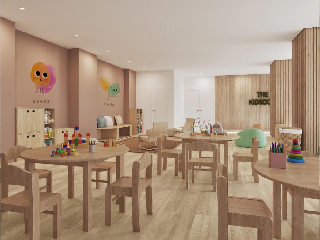 a classroom with tables and chairs in a room at Meliá Lloret de Mar in Lloret de Mar