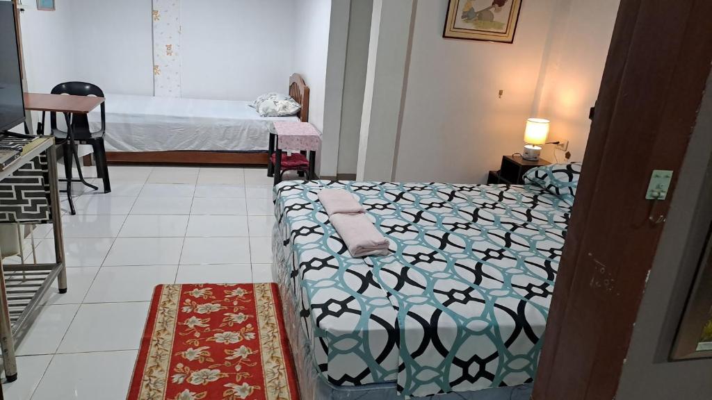 Postel nebo postele na pokoji v ubytování Dalinda's Homestay