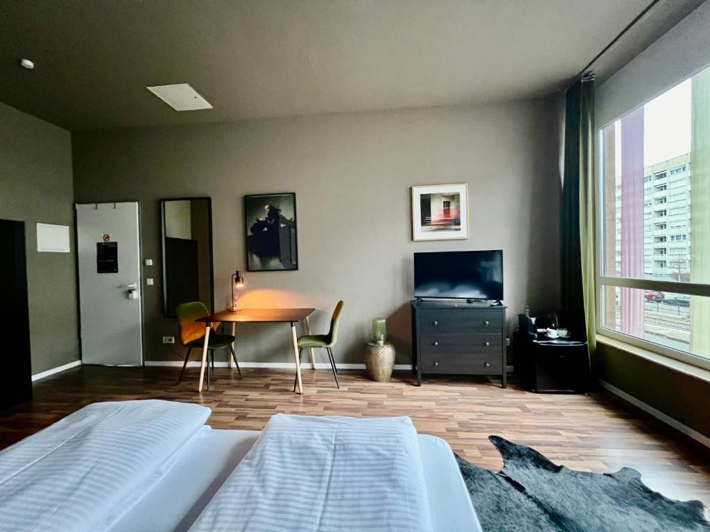 Postel nebo postele na pokoji v ubytování N8 ROOMS - by Leipzig Suites