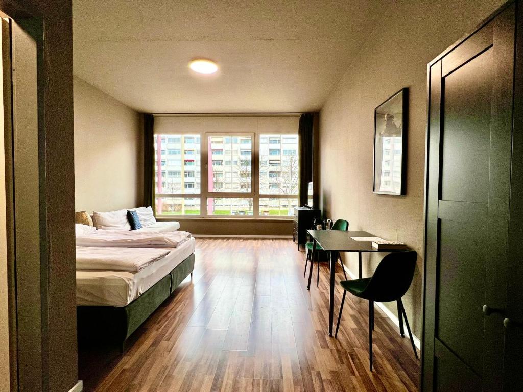 Postel nebo postele na pokoji v ubytování N8 ROOMS - by Leipzig Suites
