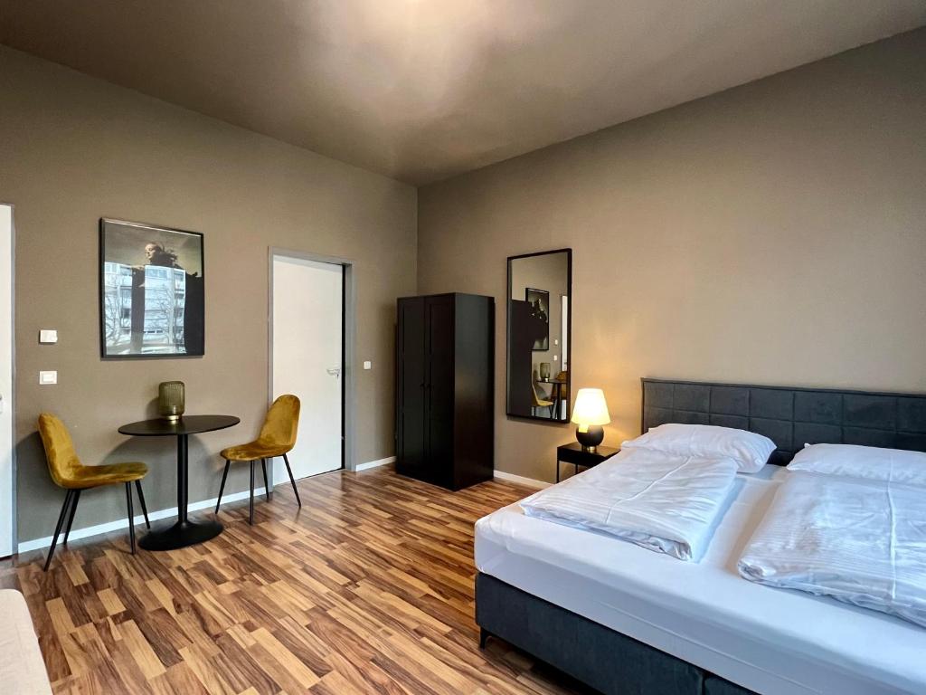 Postel nebo postele na pokoji v ubytování N8 ROOMS - by Leipzig Suites