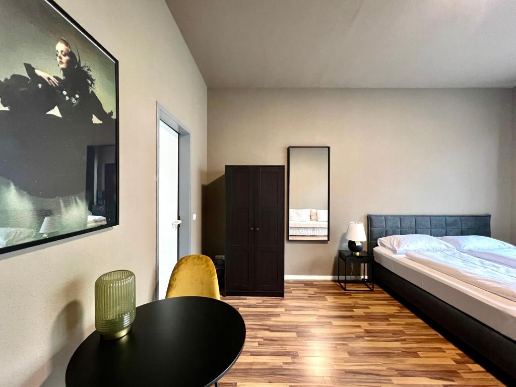 Postel nebo postele na pokoji v ubytování N8 ROOMS - by Leipzig Suites