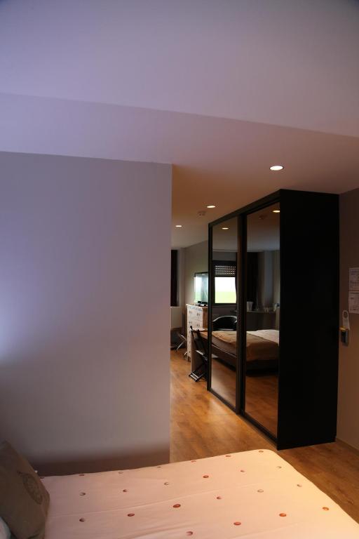 Postel nebo postele na pokoji v ubytování Hotel Callecanes
