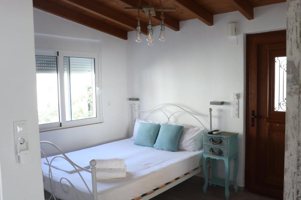 Postel nebo postele na pokoji v ubytování Vitis Vinifera Tranditional Studio Apartment