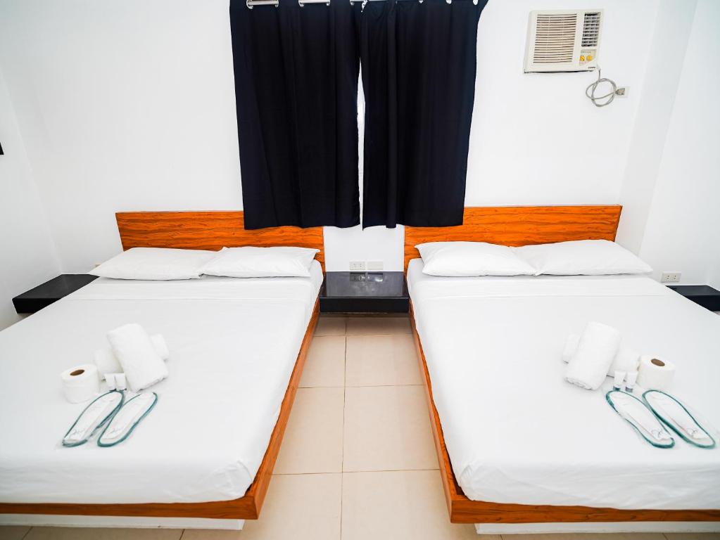 Postel nebo postele na pokoji v ubytování CJS Boracay Joint