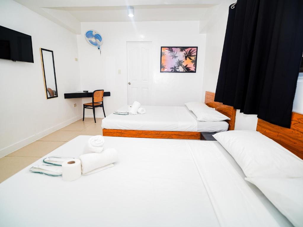 Postel nebo postele na pokoji v ubytování CJS Boracay Joint