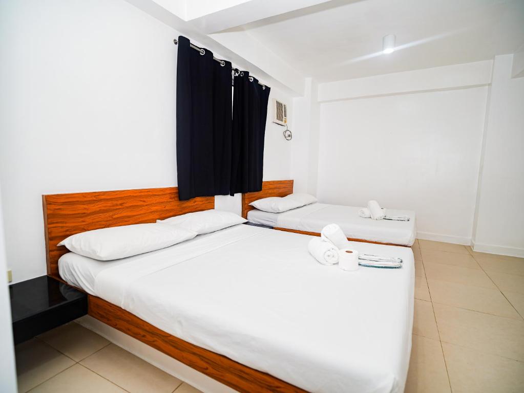Postel nebo postele na pokoji v ubytování CJS Boracay Joint
