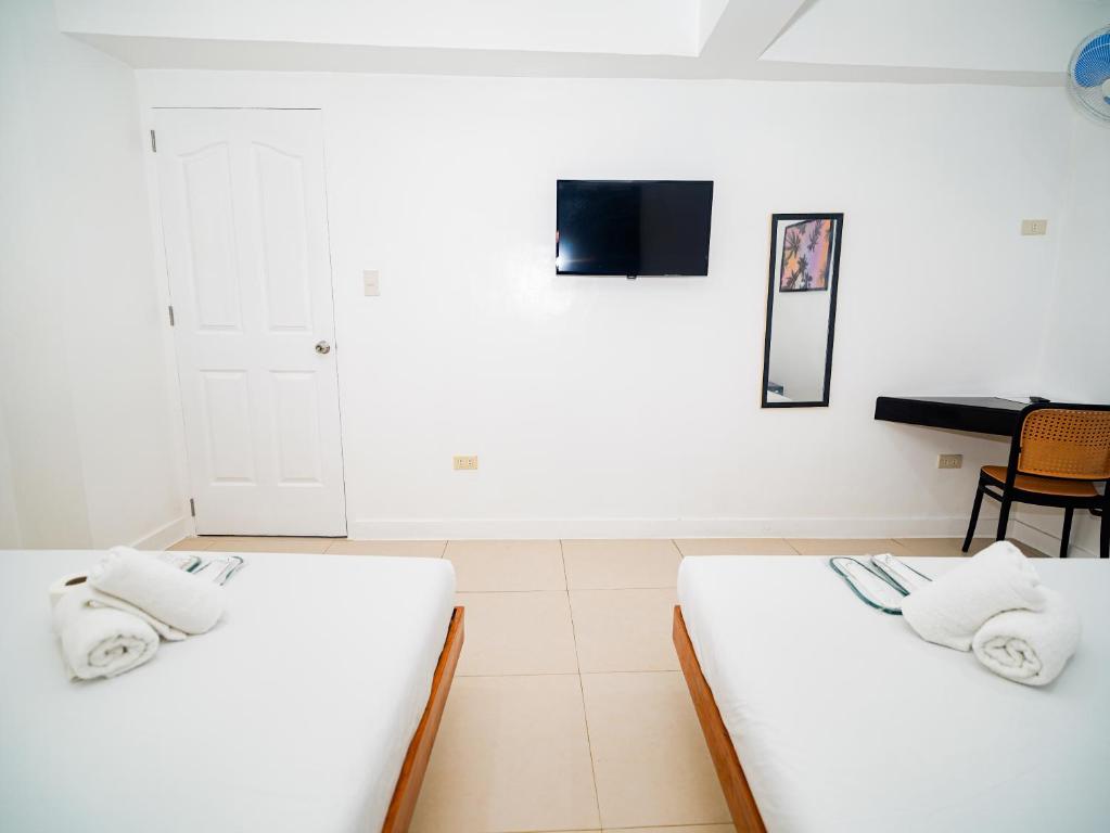 Postel nebo postele na pokoji v ubytování CJS Boracay Joint