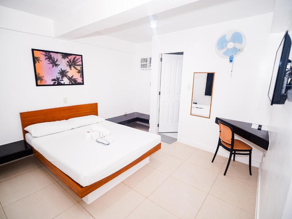 Postel nebo postele na pokoji v ubytování CJS Boracay Joint