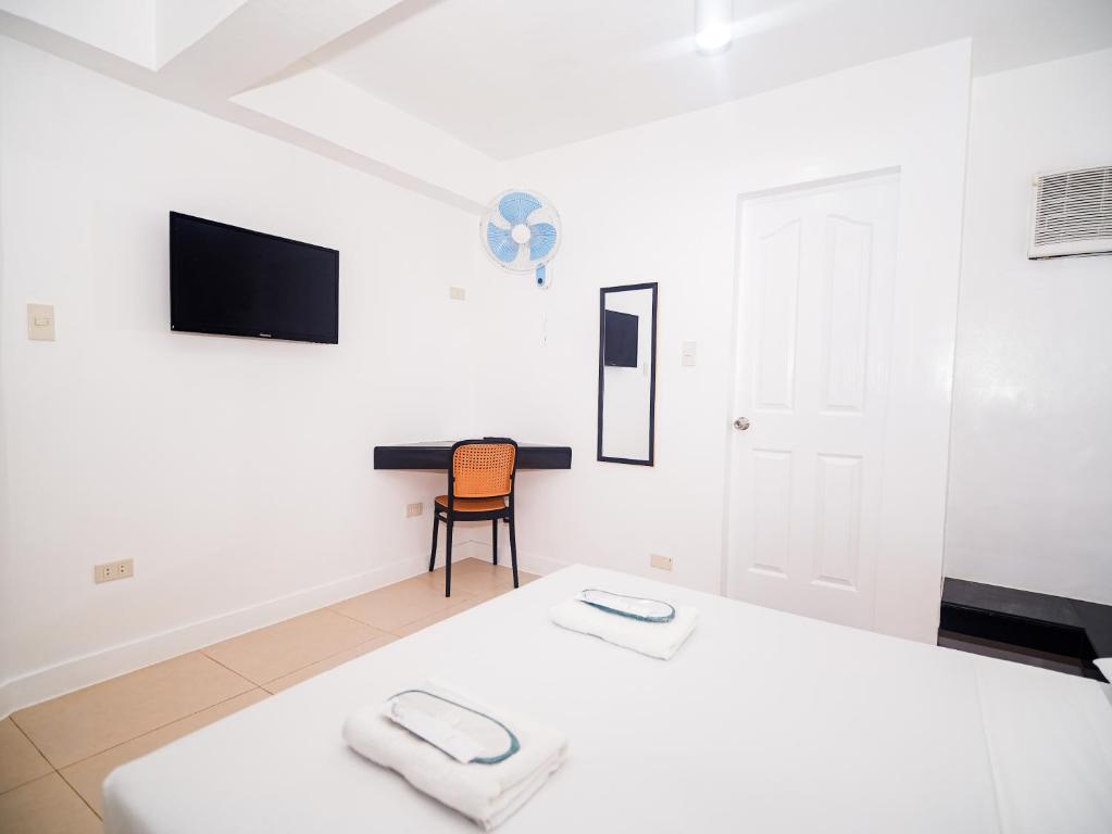 Postel nebo postele na pokoji v ubytování CJS Boracay Joint