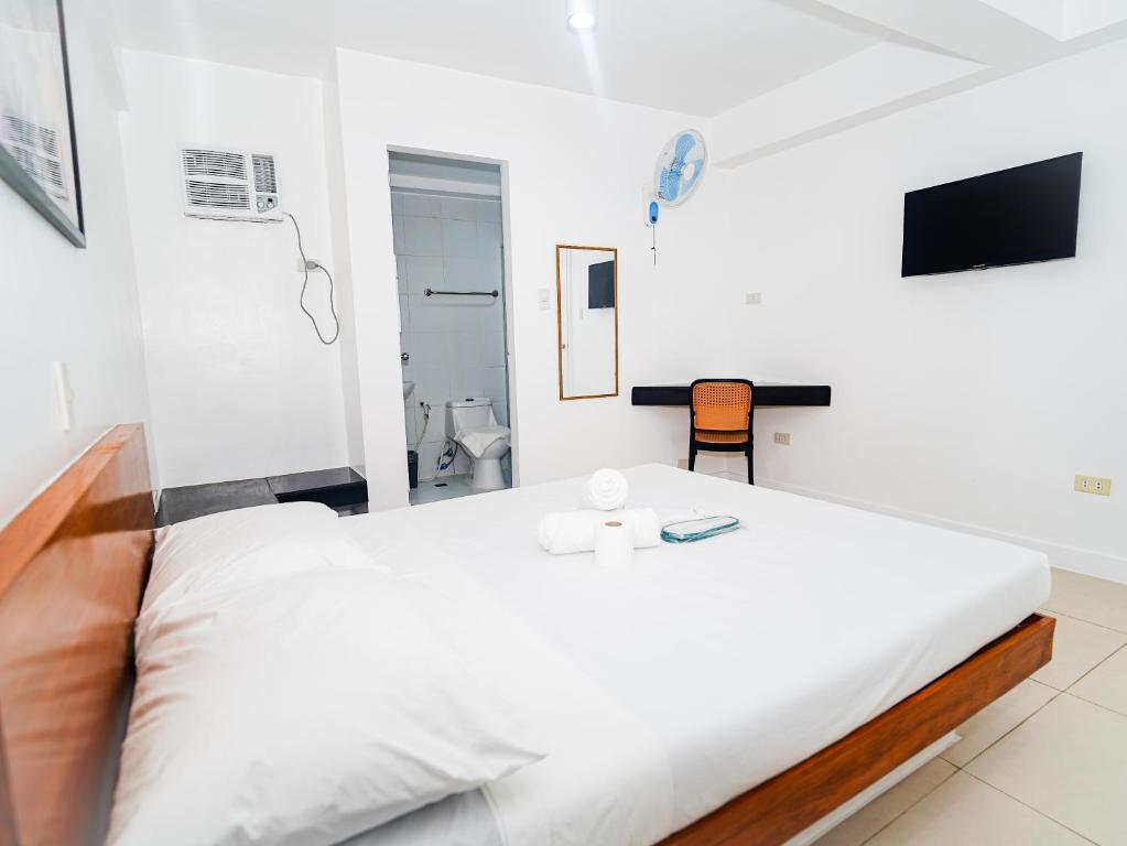 Postel nebo postele na pokoji v ubytování CJS Boracay Joint