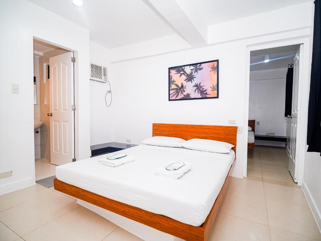 Postel nebo postele na pokoji v ubytování CJS Boracay Joint