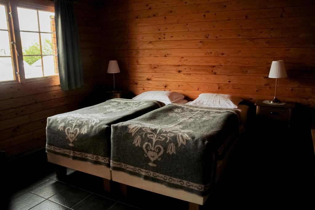 Postel nebo postele na pokoji v ubytování Vogafjós Farm Resort