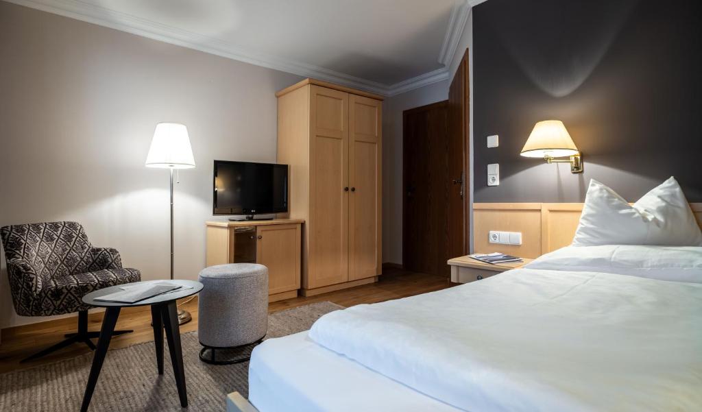 Postel nebo postele na pokoji v ubytování Hotel der Wiesenhof