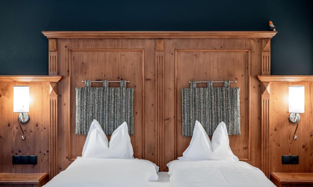 Postel nebo postele na pokoji v ubytování Hotel der Wiesenhof