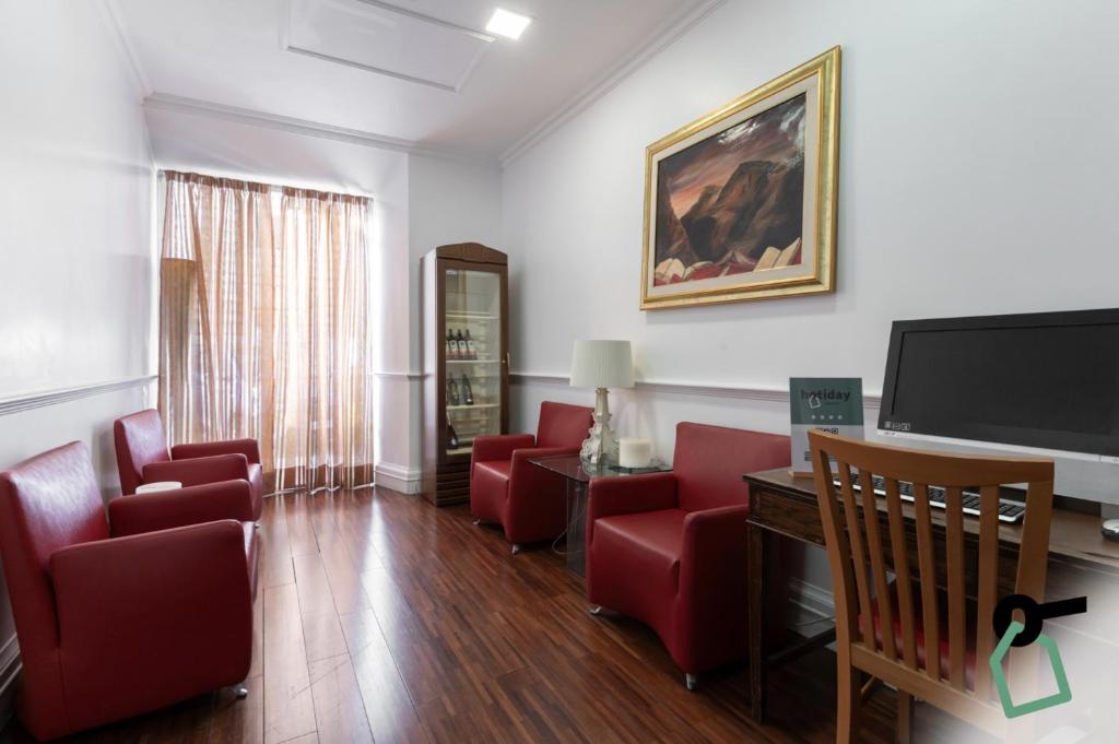 TV a/nebo společenská místnost v ubytování HOTIDAY Room Collection - Roma Porta Pia