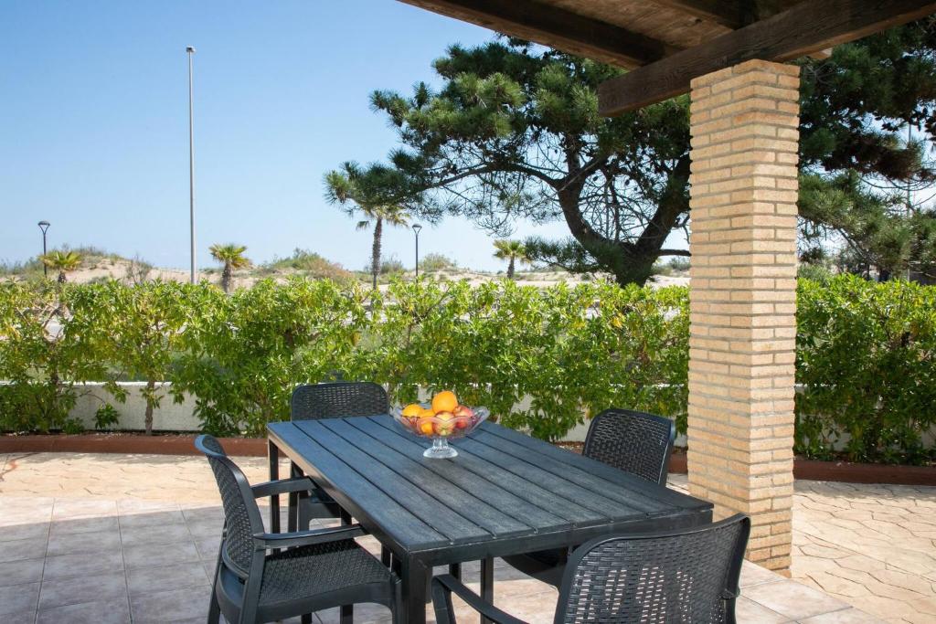 A garden outside Eusebio - Casa en Riumar para 4 personas y en primera línia de mar - Deltavacaciones