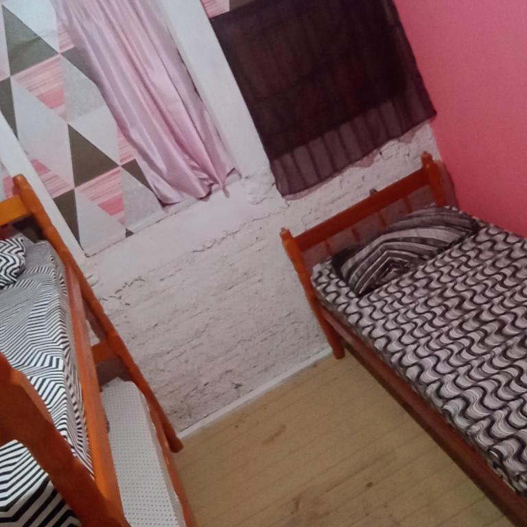 Voodi või voodid majutusasutuse Hostel formigueiro toas