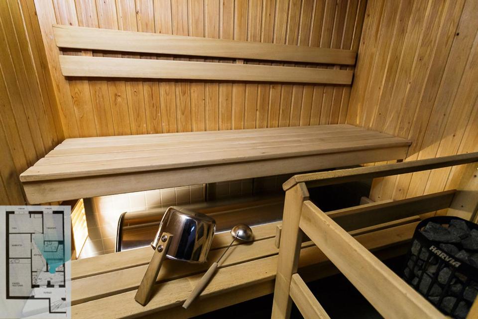 a inside of a sauna with a bench in it at Levillenet Glacier Alpine Chalets at Levi Centre in Levi