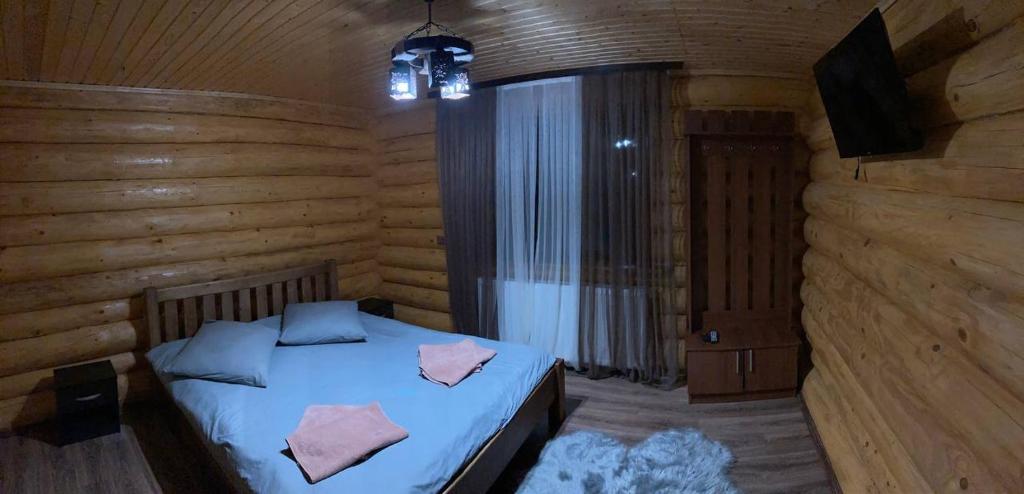 Ліжко або ліжка в номері Садиба у Пасічника