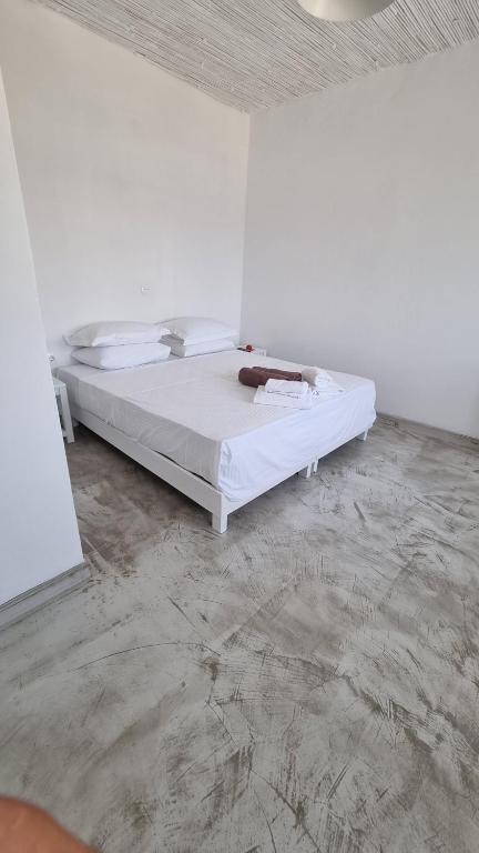 Postel nebo postele na pokoji v ubytování Sapsila Patmos Residences
