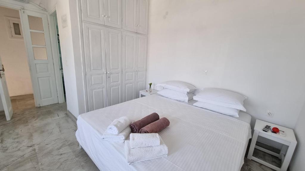 Postel nebo postele na pokoji v ubytování Sapsila Patmos Residences