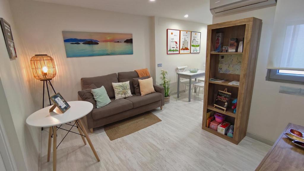 a living room with a couch and a table at APARTAMENTO LA UNIÓN in Castellón de la Plana