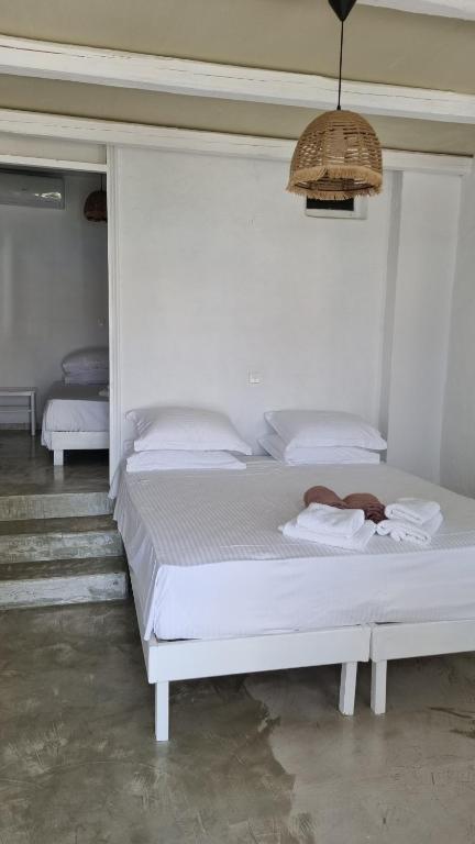Postel nebo postele na pokoji v ubytování Sapsila Patmos Residences