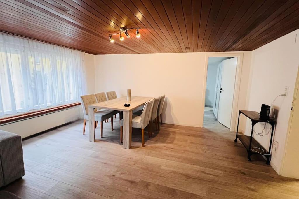 a dining room with a table and chairs at Cresta Apartment in St. Gallen